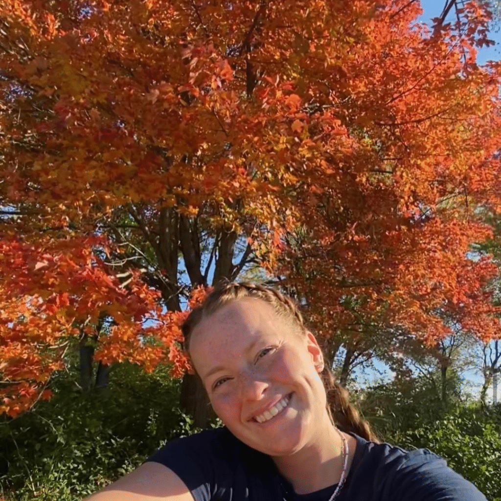 MC with fall tree behind square